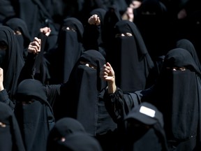 Yemeni women dressed in the niqab, take part in a demonstration on October 4, 2015 in front of the United Nations (UN) in the Yemeni capital, Sanaa, against ongoing military operations carried out by the Saudi-led coalition.