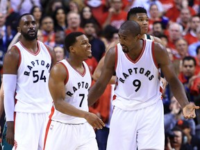 Kyle Lowry (7) and Serge Ibaka (9) talk during a playoff game against the Milwaukee Bucks on April 18.