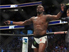 Jon Jones celebrates after knocking out Daniel Cormier in their UFC light heavyweight championship bout at UFC 214 in Anaheim on July 29.