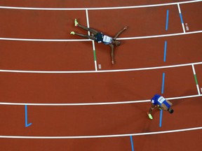 Mohammed Ahmed of Canada reacts after the the men's 10,000 metres final during the IAAF World Athletics Championships at The London Stadium on Friday in London.