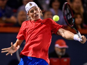 Denis Shapovalov hits a return against Alexander Zverev at the Rogers Cup on Aug. 12.