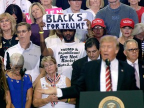 Michael the Black Man, as he calls himself, is a "Blacks for Trump" supporter of the U.S. president with a backstory as strange as his many appearances at rallies.