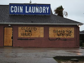 A sign on a business reads, 'Closed for Harvey', as people prepare for approaching Hurricane Harvey on August 25, 2017 in Corpus Christi, Texas.