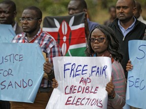 Members of civil society groups protest the killing of electoral commission information technology manager Christopher Msando, at a demonstration in downtown Nairobi, Kenya Tuesday, Aug. 1, 2017. Msando, an official crucial to running Kenya's presidential election next week, was found tortured and killed, the electoral commission chairman said Monday, as concerns grew that the East African nation's vote again could face dangerous unrest. (AP Photo/Ben Curtis)