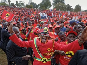Supporters of Kenya's President Uhuru Kenyatta cheer at an election rally in Uhuru Park in downtown Nairobi, Kenya Friday, Aug. 4, 2017. Kenyans are due to go to the polls on Aug. 8. to vote in presidential elections after a tightly-fought race between incumbent President Uhuru Kenyatta and main opposition leader Raila Odinga. (AP Photo/Ben Curtis)