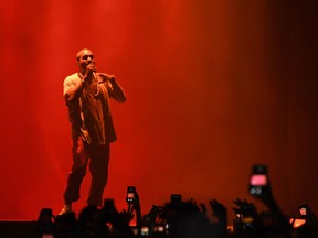 Kanye West performs in Queens, N.Y., on Oct. 2, 2016, the day before his wife Kim Kardashian was robbed at gunpoint in Paris, forcing him to cut a performance short.