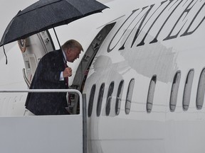 US President Donald Trump boards Air Force One at Andrews Air Force Base in Maryland on July 28, 2017 as he departs to address law enforcement personnel at Suffolk Community College in New York.