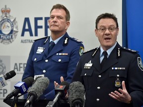 Australian Federal Police Deputy Commissioner Michael Phelan (R) speaks to the media beside New South Wales Police Deputy Commissioner David Hudson at a press conference in Sydney on August 4, 2017.