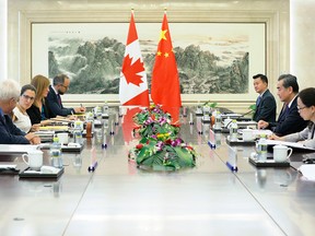 Canada's Foreign Minister Chrystia Freeland (2nd L) and her Chinese counterpart Wang Yi (2nd R) hold a meeting at the Ministry of Foreign Affairs in Beijing on August 9, 2017.