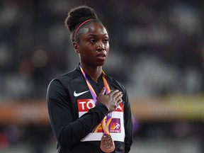 Bronze medallist US athlete Tianna Bartoletta poses on the podium during the victory ceremony for the women's long jump athletics event at the 2017 IAAF World Championships at the London Stadium in London August 11, 2017.