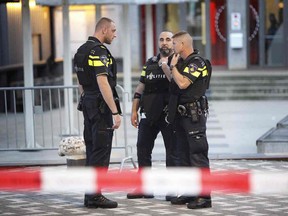 Police stand during the evacuation the Maassilo concert venue after a concert by Californian ban Allah-Las was canceled in relation to a terror attack threat, according to police and the venue, on August 23, 2017, in Rotterdam.