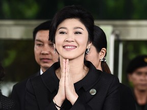 This file photo taken on July 21, 2017 shows former Thai prime minister Yingluck Shinawatra greeting her supporters as she leaves the Supreme Court in Bangkok.