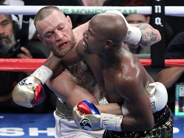 Conor McGregor and Floyd Mayweather Jr. mix it up in close quarters.