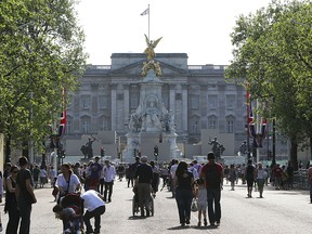 People are seen as they arrive and depart Buckingham Palace in London, UK Monday April 25, 2011.