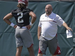 Alabama offensive coordinator, Brian Daboll, instructs quarterback Jalen Hurts (2) during an NCAA college football practice, Thursday, Aug. 3, 2017, in Tuscaloosa, Ala. (AP Photo/Brynn Anderson)