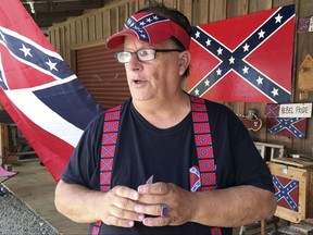 Robert Castello, owner of the Dixie General Store, discusses his dislike of neo-Nazis and the Ku Klux Klan in Chulafinee, Ala., on Thursday, Aug. 17, 2017. Castello and other supporters of Southern heritage fear that extremists are hurting their cause with protests like the rally that turned deadly in Charlottesville, Virginia. (AP Photo/Jay Reeves)