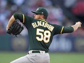 Oakland Athletics starting pitcher Paul Blackburn throws to the plate during the first inning of a baseball game against the Los Angeles Angels, Saturday, Aug. 5, 2017, in Anaheim, Calif. (AP Photo/Mark J. Terrill)