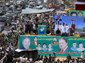Deposed Pakistani Prime Minister Nawaz Sharif, center, addresses to supporters during a rally in Muridke, Pakistan, Saturday, Aug. 12, 2017. Sharif is currently holding on-the-road rallies across Punjab, in a move aimed at demonstrating his political strength amid tight security. Sharif criticized the country's judiciary for disqualifying him from office for concealing assets. (AP Photo/Anjum Naveed)