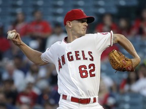 Los Angeles Angels starting pitcher Parker Bridwell throws to a Philadelphia Phillies batter during the first inning of a baseball game, Thursday, Aug. 3, 2017, in Anaheim, Calif. (AP Photo/Jae C. Hong)