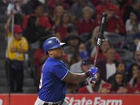 Texas Rangers' Adrian Beltre watches his solo home run during the fourth inning of a baseball game against the Los Angeles Angels, Wednesday, Aug. 23, 2017, in Anaheim, Calif. (AP Photo/Mark J. Terrill)