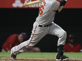 Baltimore Orioles' Caleb Joseph hits a RBI single to tie the game during the fifth inning of a baseball game against the Los Angeles Angels, Tuesday, Aug. 8, 2017, in Anaheim, Calif. (AP Photo/Jae C. Hong)