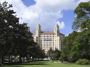 This Wednesday, Aug. 16, 2017, photo shows The Arlington Resort Hotel and Spa in Hot Springs, Ark. The landmark hotel in central Arkansas where one of the world's most famous mobsters frequented is in jeopardy of closing if safety concerns aren't addressed by November. (Mara Kuhn/The Sentinel-Record via AP)