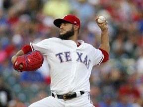 Texas Rangers starting pitcher Martin Perez works against the Chicago White Sox during the first inning of a baseball game, Saturday Aug. 19, 2017, in Arlington, Texas. (AP Photo/Roger Steinman)