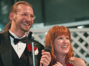 In this June 13, 1998 file photo, David Weinlick and Elizabeth Runze speak to the audience after Runze was picked to be Weinlick's bride at Mall of America in Bloomington, Minn.