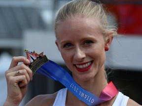 Sage Watson holds her 400-metre hurdles gold medal at the Canadian championships in Ottawa on July 9.