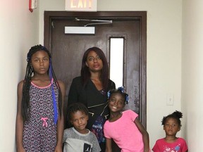 This Monday, Aug. 7, 2017 photo shows Laura Wheaton and her four children in the Peachtree-Pine homeless shelter. With the shelter closing at the end of the month, "It's hard not knowing where we're going to live," said Wheaton, 34, who has been staying at the shelter with her children for more than a month. (AP Photo/Robert Ray)