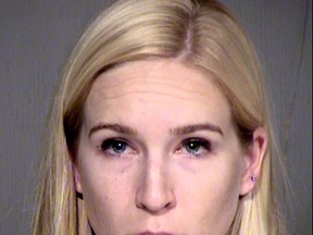 This undated photo released by the Maricopa County, Ariz., Sheriff's Office shows Keri Harwood, who was arrested Sunday, Aug. 13, 2017, on suspicion of five counts each of child molestation and sexual exploitation of a minor. The 28-year-old Arizona woman is accused of molesting two young children and selling videos of the acts on the internet. (Maricopa County Sheriff's Office via AP)