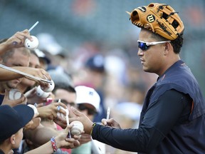 Detroit Tigers' Miguel Cabrera signs items for fans during batting practice before the team's baseball game against the Baltimore Orioles, Saturday, Aug. 5, 2017, in Baltimore. (AP Photo/Nick Wass)
