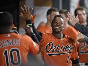 Baltimore Orioles' Tim Beckham (1) celebrates his home run in the dugout during the eighth inning of a baseball game against the Detroit Tigers, Saturday, Aug. 5, 2017, in Baltimore. (AP Photo/Nick Wass)