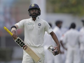 FILE - In this July 26, 2017 file photo, India's Abhinav Mukund during the first test cricket match between India and Sri Lanka in Galle, Sri Lanka. In a series of Twitter posts, including one long statement, batsman Abhinav Mukund said people had been "posting abuses" and "saying absolutely derogatory things about the tone of my skin.". (AP Photo/Eranga Jayawardena, File)