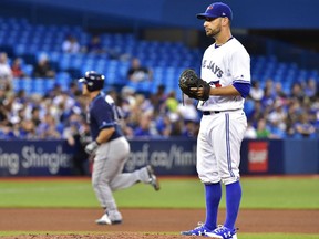 Blue Jays starting pitcher Marco Estrada stands on the mound as Tampa Bay Rays' Wilson Ramos rounds the bases after hitting a solo home run in the fourth inning of their game in Toronto on Tuesday night.