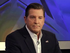FILE - In this July 22, 2015, file photo, co-host Eric Bolling appears on "The Five" television program, on the Fox News Channel, in New York. Bolling is suing the reporter who broke the story that he allegedly sent lewd text messages to colleagues. Bolling filed a $50 million defamation lawsuit Wednesday against Yashar Ali, a Huffington Post contributing writer. (AP Photo/Richard Drew, File)