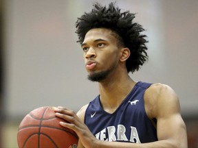 In this Monday, Jan. 16, 2017, file photo, Sierra Canyon's Marvin Bagley III #35 warms up against La Lumiere during a high school basketball game at the Hoophall Classic in Springfield, MA. Bagley III, a top high school prospect, has committed to Duke and reclassified for the 2017-18, immediately making the Blue Devils a top national-title contender this season. (AP Photo/Gregory Payan, File )