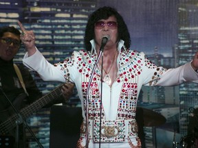 In this Aug. 10, 2017, photo, Douglas Masuda, Elvis of Japan performs on stage in Manila, Philippines, for the "Elvis Tribute Night: Young Once v.s. Young Ones" event. Elvis Presley, crowned as the "King of Rock and Roll," will be celebrating his 40th death anniversary this year. To pay tribute to the legend, the Elvis Presley Friendship Club, Philippines International has organized a special event that brings together both veteran and up-and-coming Elvis Tribute Artists. (AP Photo/Cecilia Forbes)