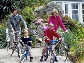 FILE - In this June 1, 1989 file photo, Britain's Prince Charles and Princess Diana and their sons, Princes William, right, and Harry begin a cycle ride around the island of Tresco, one of the Scilly Isles, England. The royal family was vacationing in the islands, located off the southwest tip of Britain. It has been 20 years since the death of Princess Diana in a car crash in Paris and the outpouring of grief that followed the death of the "people's princess." (AP Photo, File)