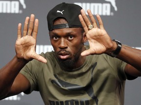 Jamaican athlete Usain Bolt gestures as he addresses the media during a press conference ahead of the World Athletics championships in London, Tuesday, Aug. 1, 2017