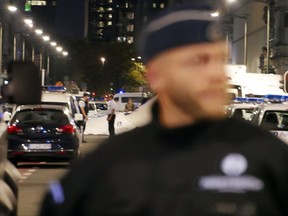 Police secure a scene in downtown Brussels after a reported knife attack on Belgian Army soldiers on Friday, Aug. 25, 2017. Belgium's anti-terror crisis center says soldiers have "neutralized" a man in downtown Brussels, amid media reports that the man may have been shot after attacking troops with a knife. (AP Photo/Sylvain Plazy)