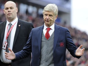 Arsenal manager Arsene Wenger reacts towards Arsenal fans as he leaves the pitch after the final whistle during the English Premier League soccer match between Stoke City and Arsenal at the Bet365 Stadium in Stoke on Trent, England, Saturday, Aug. 19, 2017. (AP Photo/Rui Vieira)