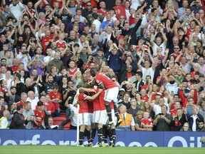 Manchester United's celebrate scoring their sides first goal during the English Premier League soccer match between Manchester United and Leicester City at Old Trafford in Manchester, England, Saturday, Aug. 26, 2017. (AP Photo/Rui Vieira)