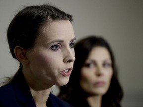 Former Olympic gymnast Rachael Denhollander, left, speaks as 2000 Olympic bronze medalist Jamie Dantzscher listens during a news conference in Anaheim, Calif., Thursday, Aug. 17, 2017. Dantzscher and Denhollander have filed civil lawsuits against USA Gymnastics and a former team doctor claiming they were sexually abused during their careers and want the organization to remove members of the organization's board of directors. (AP Photo/Chris Carlson)