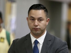 In this Sept. 30, 2016, photo, Contra Costa Sheriff's deputy Ricardo Perez arrives for an arraignment hearing at the Hayward Hall of Justice in Hayward, Calif. Authorities say Perez, a former San Francisco Bay Area sheriff's deputy, faces an additional sex charge for his alleged involvement in a wide-ranging police sex scandal involving a teenager. The East Bay Times reported that the Alameda County District Attorney's office filed the felony unlawful sex with a minor charge against Perez on Monday, Aug. 7, 2017. (Anda Chu/Bay Area News Group via AP)