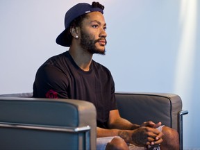 In this Friday, Aug. 25, 2017, photo, Cleveland Cavaliers point guard, Derrick Rose poses for a photo at his agent's Wasserman Media Group offices in Los Angeles. Rose, 28, the former MVP is coming off a fourth knee surgery, though now will be pairing with LeBron James and joining a team that has made three consecutive trips to the NBA Finals. (AP Photo/Damian Dovarganes)