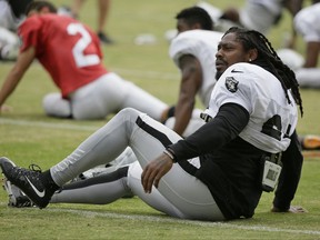 Oakland Raiders running back Marshawn Lynch stretches during an NFL football training camp Friday, Aug. 4, 2017, in Napa, Calif. (AP Photo/Eric Risberg)