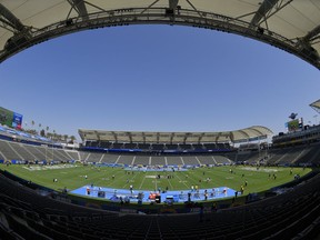 Players for the Seattle Seahawks and the Los Angeles Chargers walk on the field before a preseason NFL football game at the StubHub Center, Sunday, Aug. 13, 2017, in Carson, Calif. (AP Photo/Mark J. Terrill)