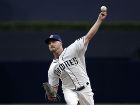 San Diego Padres starting pitcher Travis Wood works against a Philadelphia Phillies batter during the first inning of a baseball game, Monday, Aug. 14, 2017, in San Diego. (AP Photo/Gregory Bull)