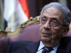 FILE - In this Tuesday, Dec. 10, 2013, file photo, Amr Moussa, the chairman of Egypt's 50-member panel tasked with amending its Islamist-drafted constitution, listens during an interview with The Associated Press at the Shoura Council in Cairo. The head of the panel that drafted Egypt's 2014 constitution, possibly the most progressive in the country's history, has denounced calls to amend the charter, saying parliament should focus instead on implementing it. (AP Photo/Amr Nabil, File)